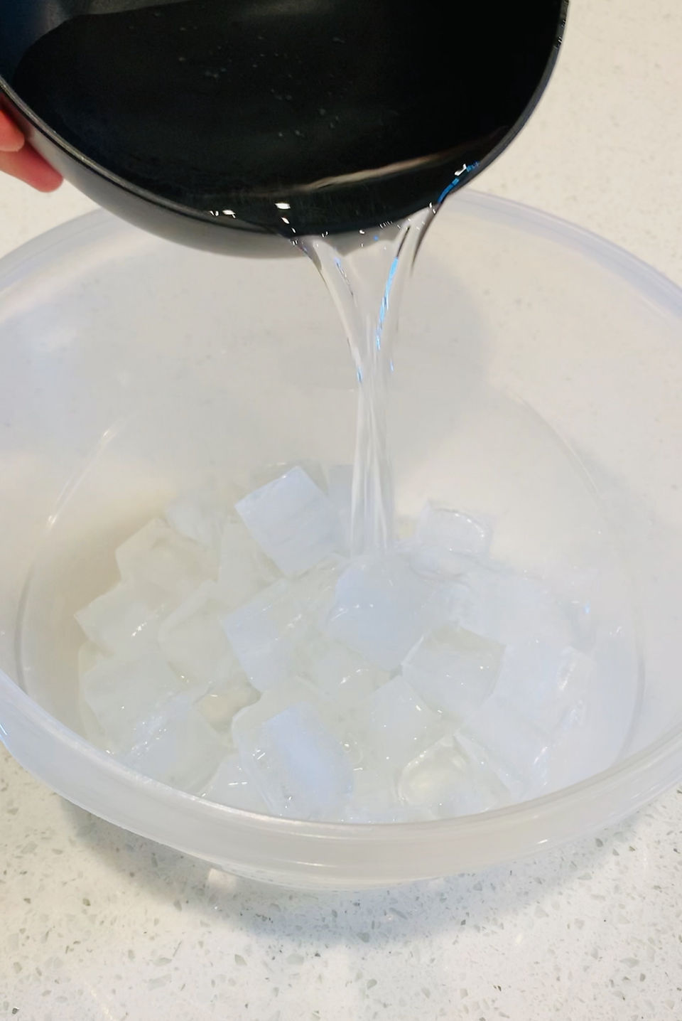 Beating cold cream cheese in a chilled mixing bowl