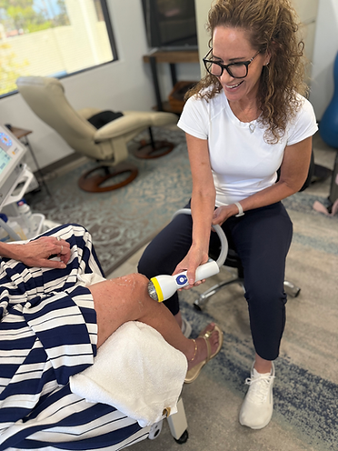 SoftWave therapy treatment applied to a patient's knee
