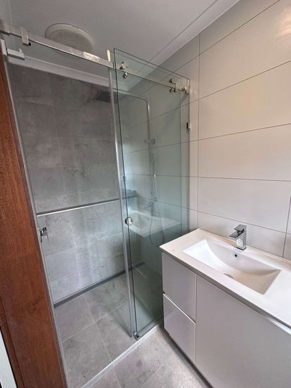 silver frameless sliding shower screen Melbourne (aka barn door shower screens)