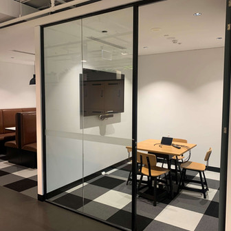 white/grey office fit out sydney by east coast fitout Co break out rooms