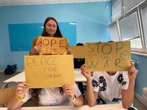Yona Tukuser holds a "HOPE FOR PEACE"