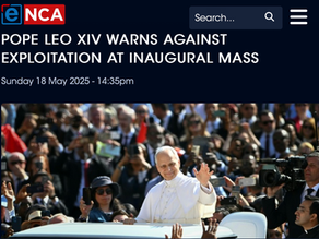 Yona Tukuser holds a "HOPE FOR PEACE" sign in St. Peter's Square at the Vatican during the Conclave