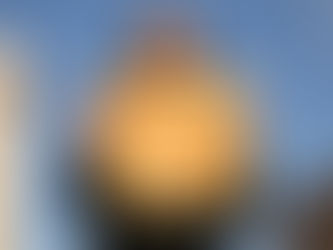 Yona Tukuser holds a "HOPE FOR PEACE" sign in St. Peter's Square at the Vatican during the Conclave