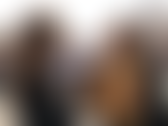 Yona Tukuser holds a "HOPE FOR PEACE" sign in St. Peter's Square at the Vatican during the Conclave