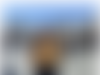 Yona Tukuser holds a "HOPE FOR PEACE" sign in St. Peter's Square at the Vatican during the Conclave