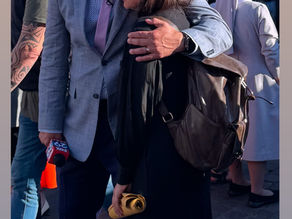 Yona Tukuser holds a "HOPE FOR PEACE" sign in St. Peter's Square at the Vatican during the Conclave