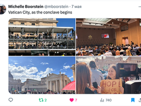 Yona Tukuser holds a "HOPE FOR PEACE" sign in St. Peter's Square at the Vatican during the Conclave
