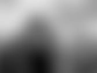 Yona Tukuser holds a "HOPE FOR PEACE" sign in St. Peter's Square at the Vatican during the Conclave