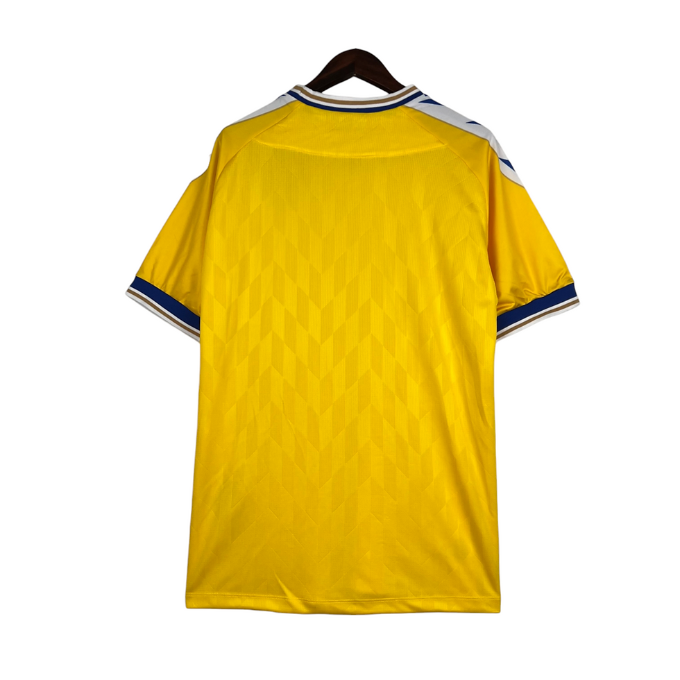 Miniatura: Camisa Cadiz I 23/24 - Torcedor Macron Masculina - Amarela com detalhes em azul 