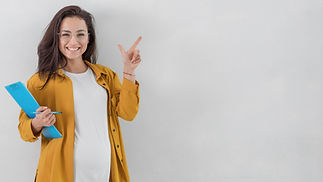 smiley-pregnant-woman-holding-clipboard-pointing-up-with-copy-space.jpg