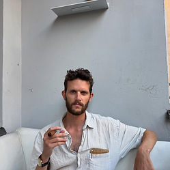 Matan Tal filmmaker Berlin cigar portrait — director of essay films like The Invention of Chris Marker