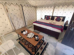 Angel Desert Camp tent bedroom with snacks.jpg