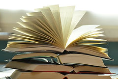 stack of open books website.jpeg