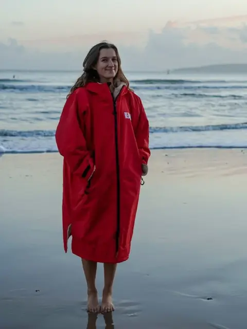 a woman wearing a red bath robe