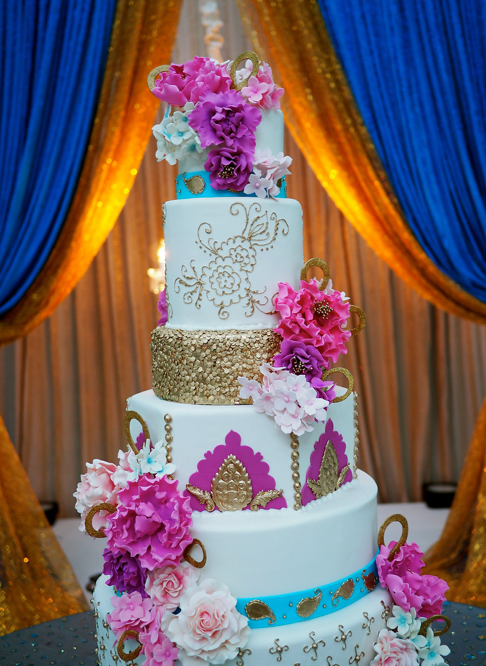 Fuschia and gold wedding cake