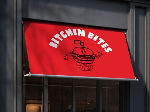 a store front for a restaurant called bitchin bites