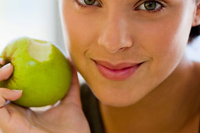 Woman eating an apple