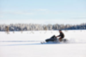 Snowmobile plowing