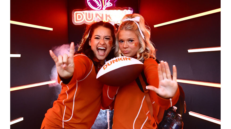 A Vogue Booth themed out for Dunkin at a live sporting event