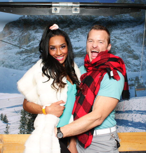 Couple bundled in scarfs on ski lift