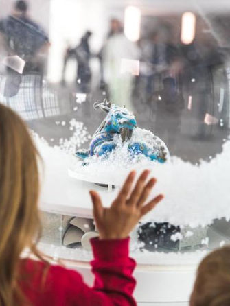 A child looking into one of the Glow Globes.