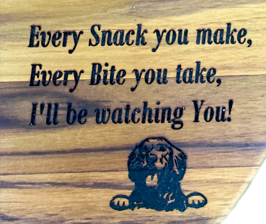 Thumbnail: A close up of an engraving of a dog and saying