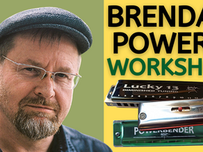 Image of harmonica player Brendan Power. Image of various harmonicas in pile. Text: BRENDAN POWER'S WORKSHOP
