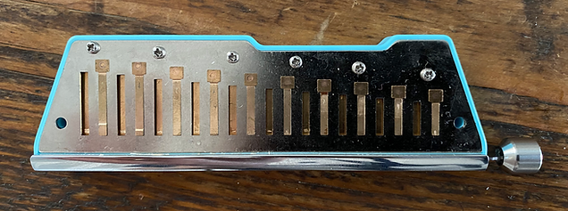 JDR Trochilus (Game Changer) harmonica with cover plates removed, showing reed plate.