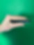 Hand holding a harmonica