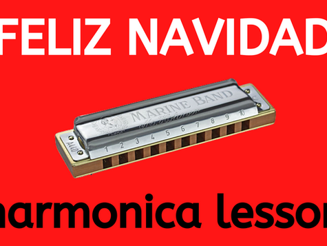 Harmonica in front of red background with text "FELIZ NAVIDAD harmonica lesson"