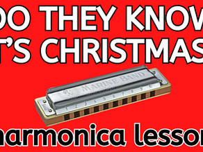 Diatonic harmonica in front of red background. Text: DO THEY KNOW IT'S CHRISTMAS? harmonica lesson