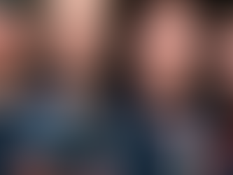 Image of the band Coldplay as young men, head and shoulders only, looking straight ahead with serious faces.