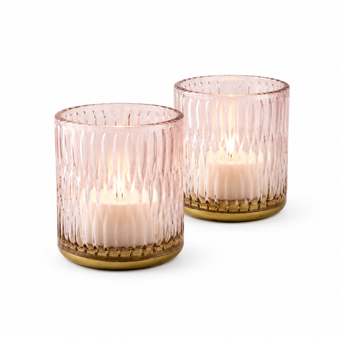 Pink ribbed glass tealight holder with warm gold-toned base