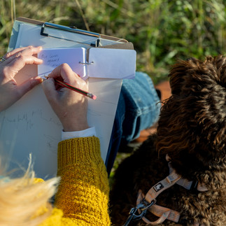 Claire Hankey drawing with her dog 