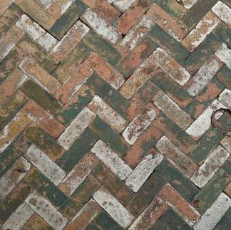 Beautiful weathered tiles in terracotta, green and white. 