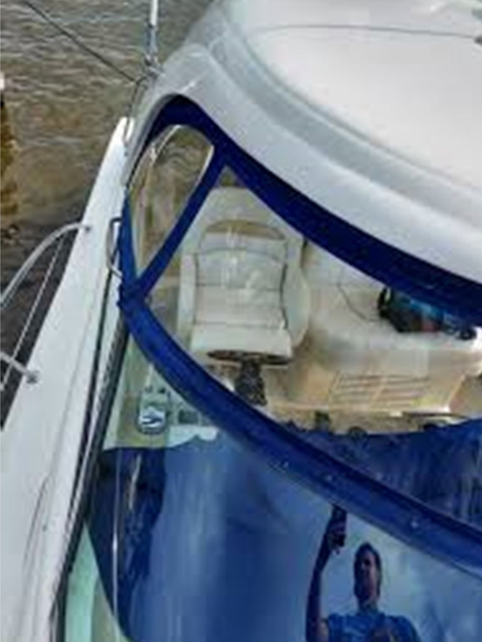 Perfectly clean and protected isinglass protecting the cockpit of a boat.