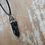 Thumbnail: Snowflake obsidian point pendant 