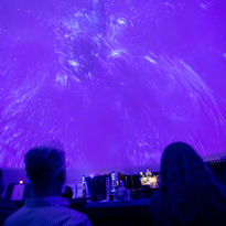 "Stellar Performances & Cosmic Concerts" presents excerpts from an exceptional collection of live shows that delve into the intersection of art, music, and the cosmos. Ranging from interactive space exploration to Reggie Watts' inventive musical comedy, this collection celebrates creativity and discovery. It highlights and showcases top live performances from the past two years for music and theater enthusiasts, as well as anyone seeking a unique, interactive theater or concert experience.