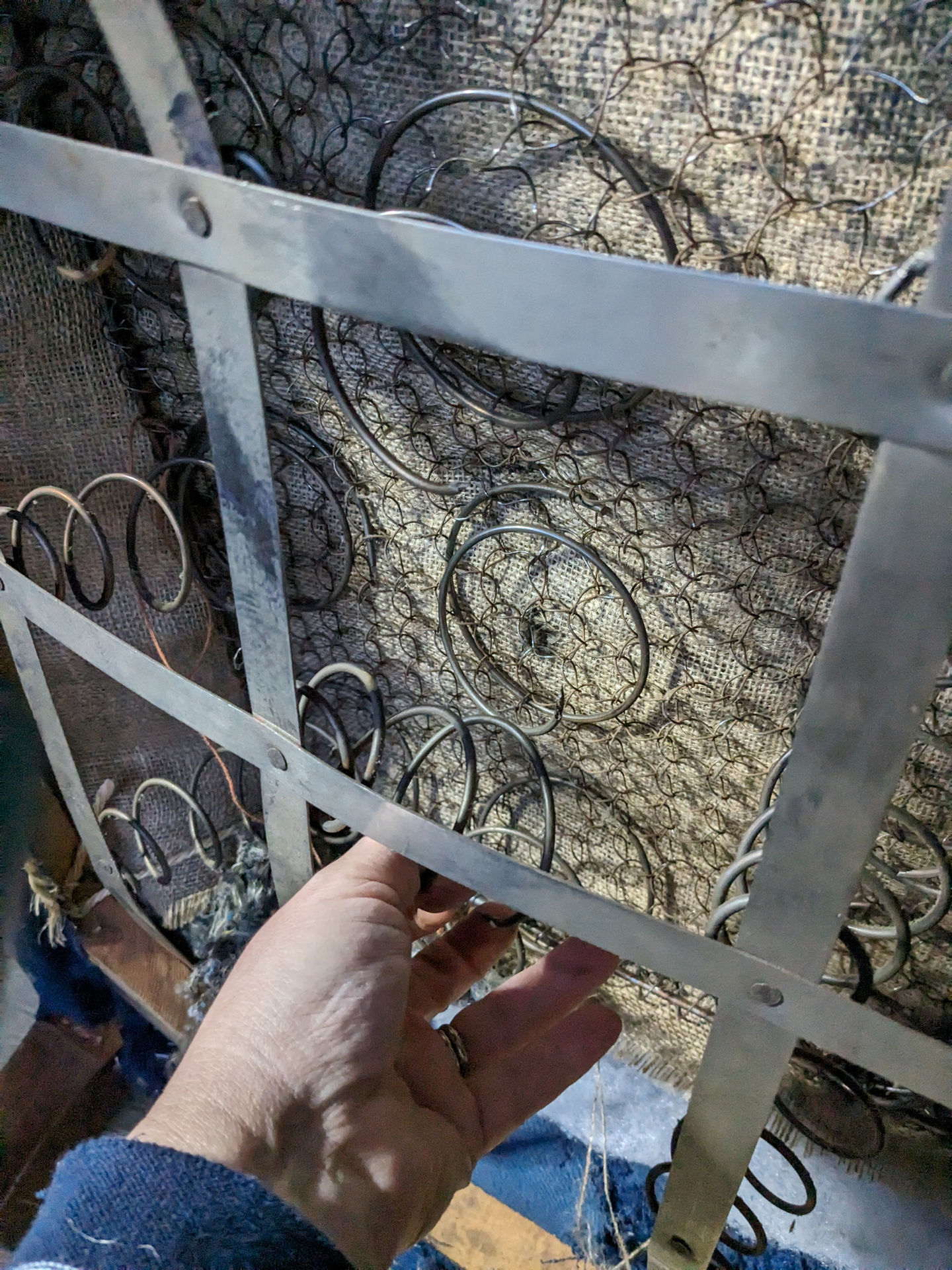 Broken springs on antique armchair