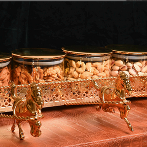 Dry fruit tray with stand for festive gifting.