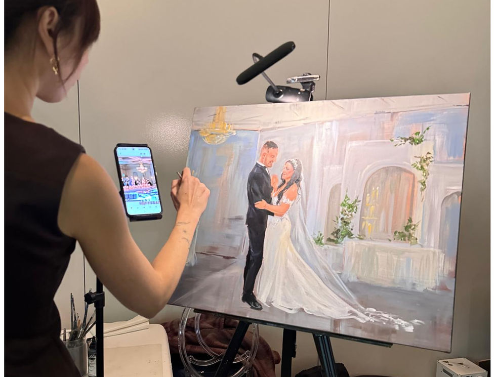 A live wedding painter capturing a special moment during a wedding ceremony.