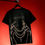 Thumbnail: A black unisex oversized T-shirt displayed against a red background.