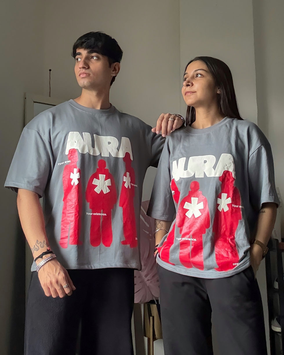 Unisex oversized grey SEWCODE T-shirt with AURA graphic print.