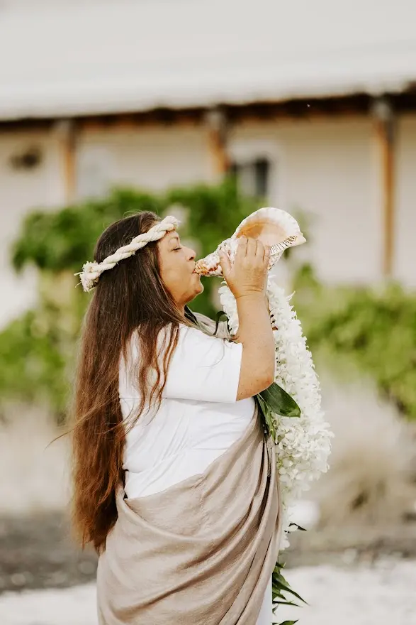 Michaela Blowing the Conch.webp