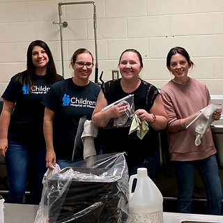 Volunteers from Chorus Community Health Plans helping at the FoodRight offices