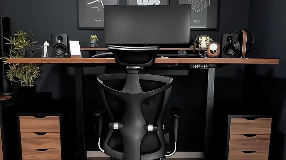 Modern terracotta home office setup with minimalist black decor and large monitor.