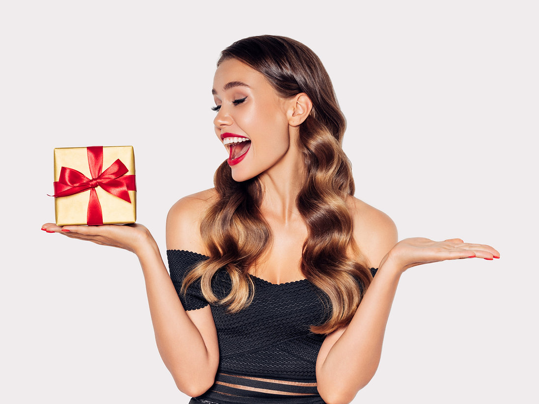 Beautiful-woman-with-present-1189890685_2003x1502.jpeg