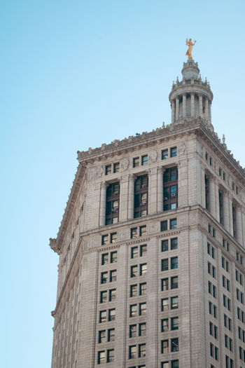 The detailing of a piece of architecture in New York City, America on a clear autumns day.