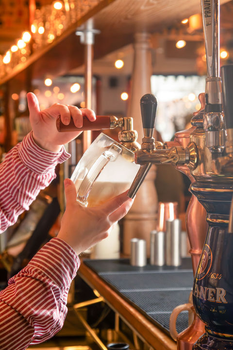 A pint of Pilsner Urquell being poured at Albert's Schenke, Liverpool.