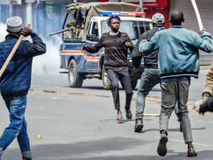 Violent hooligans approach an unarmed citizen as police watch